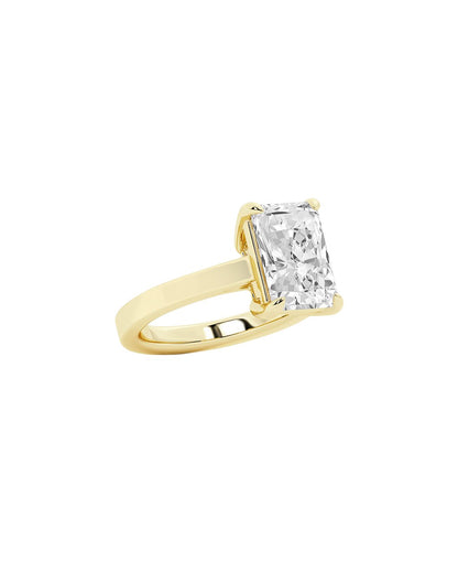 Gold ring with a diamond on a white background