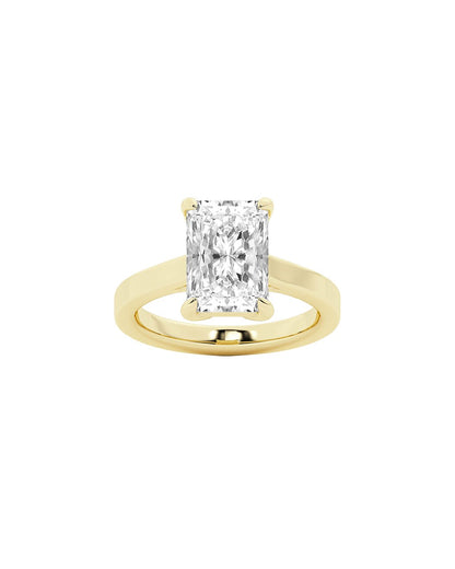 Gold ring with a large radiant cut diamond on a white background