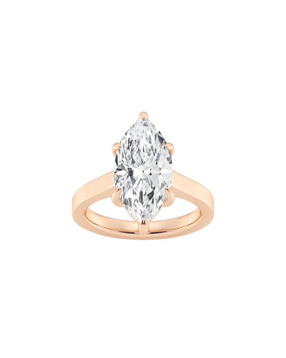 Rose gold ring with a pear-shaped diamond on a white background