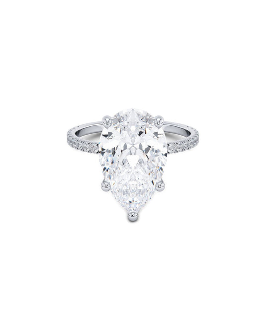 Pear-shaped diamond ring on a white background
