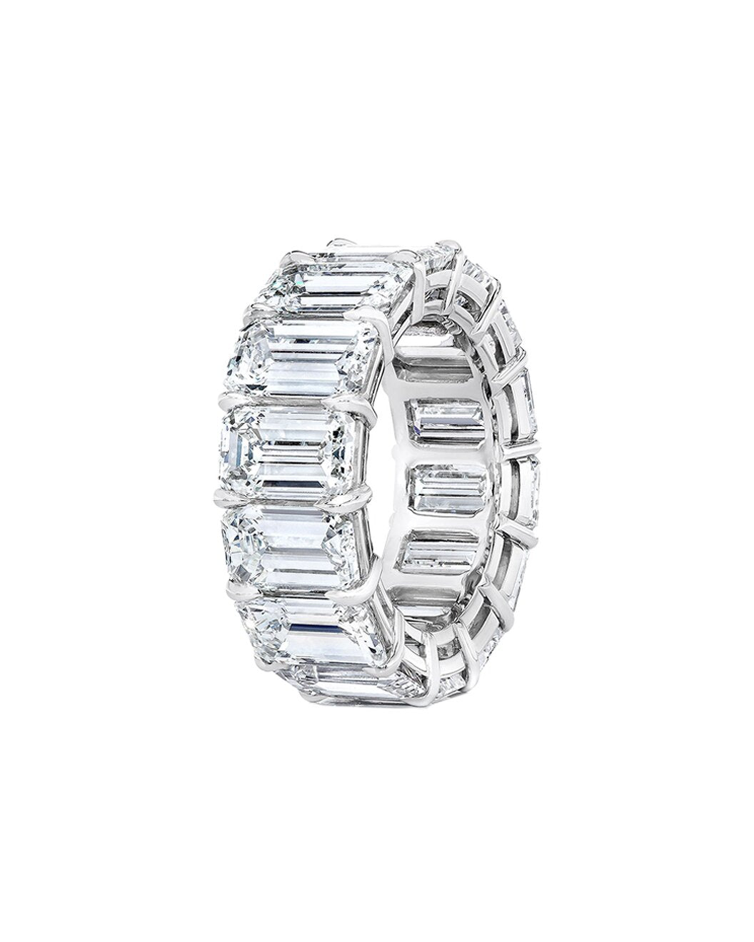 Diamond ring with emerald-cut stones on a white background