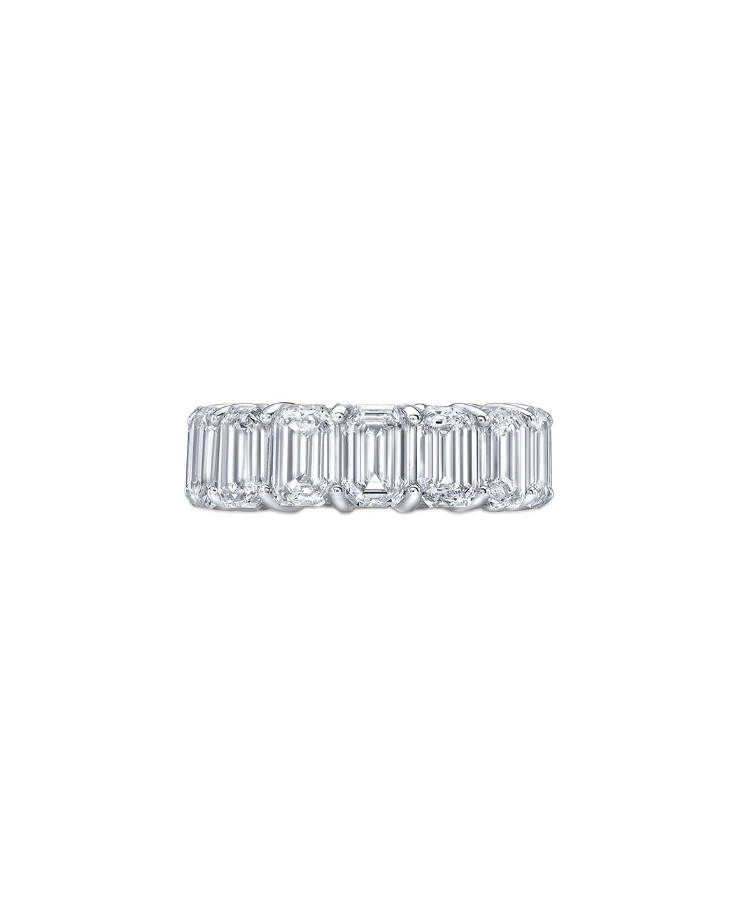Diamond ring with emerald-cut stones on a white background