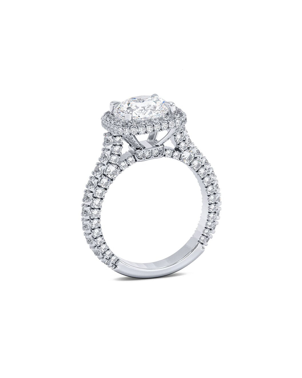 Diamond ring with a central gemstone and surrounding smaller stones on a white background Side