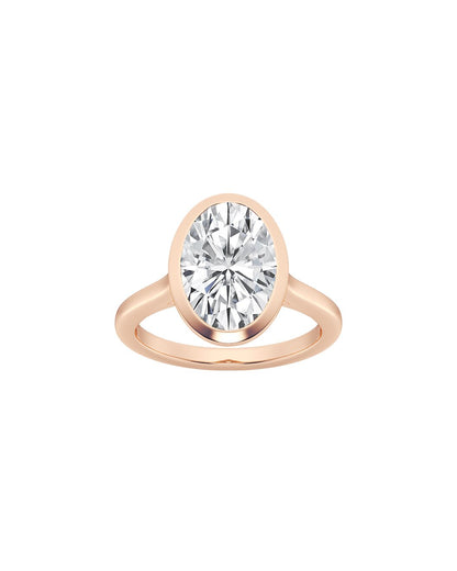 Rose gold ring with a large diamond on a white background