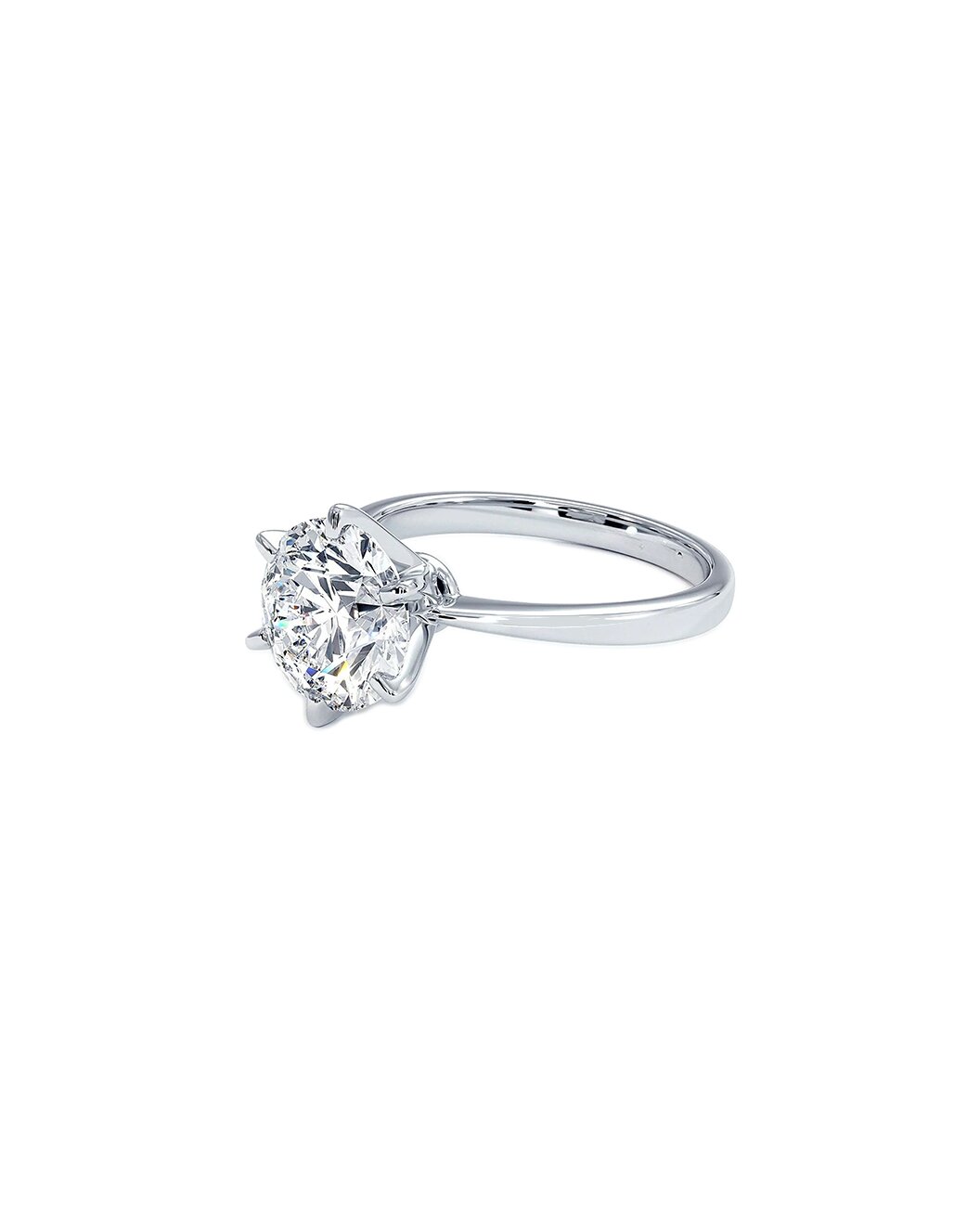 6 prong Diamond solitaire ring on a white background Side