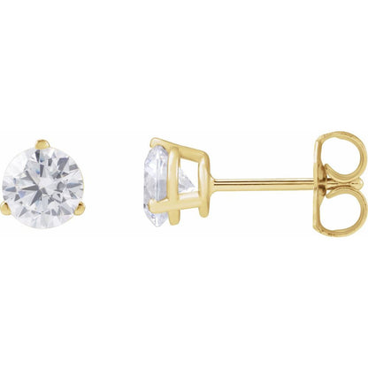 Gold stud earrings with clear diamonds on a white background