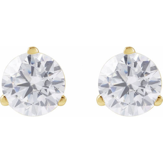Gold earrings with clear diamonds on a white background