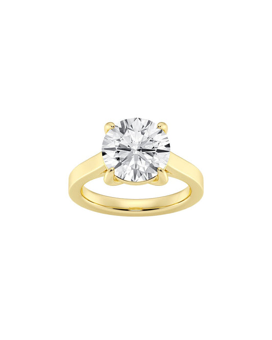 Gold ring with a large diamond on a white background front