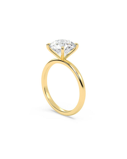 Gold ring with a large diamond on a white background