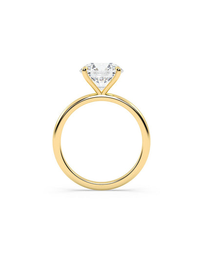 Gold ring with a round-shaped diamond on a white background