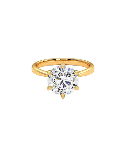 Gold ring with a large diamond on a white background front