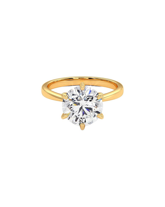 Gold ring with a large diamond on a white background front