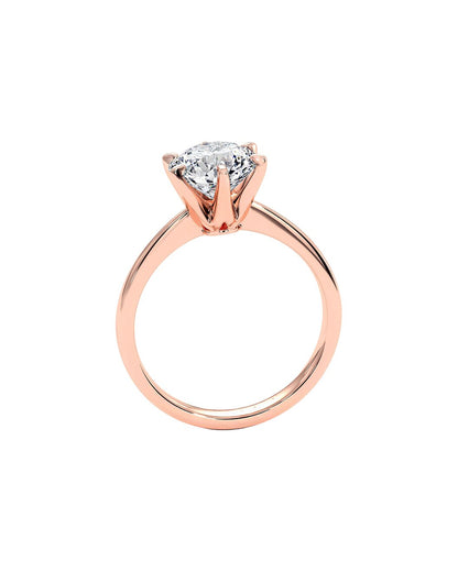 Rose gold ring with a diamond on a white background