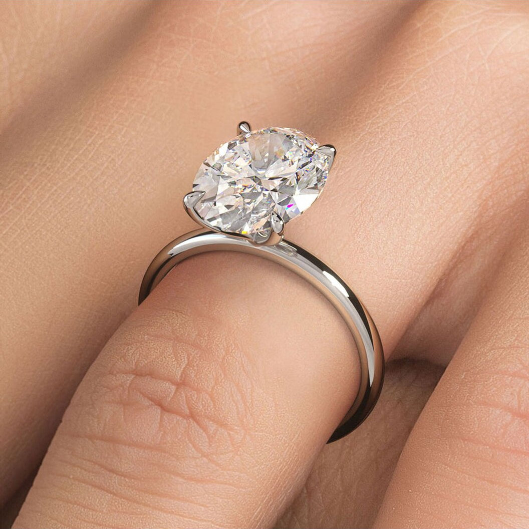 Liravina 5 Carat Oval Cut Lab Grown Diamond Engagement Ring in 14k White Gold On Model