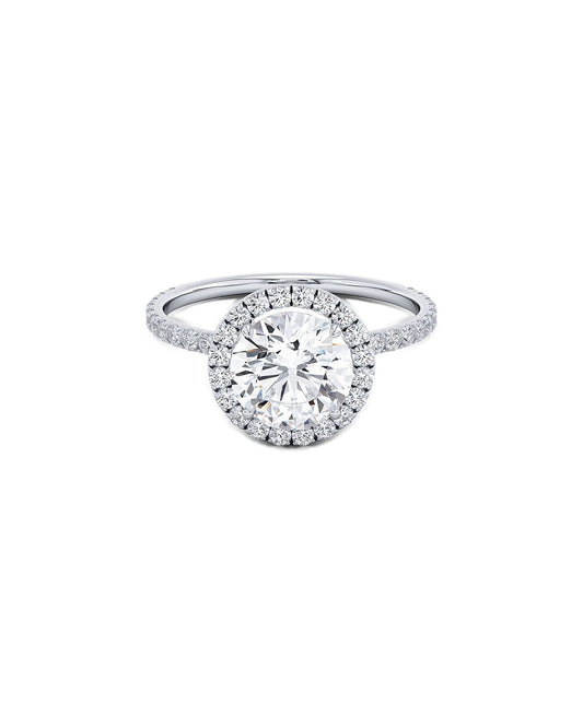 Diamond ring with a round-shaped halo on a white background