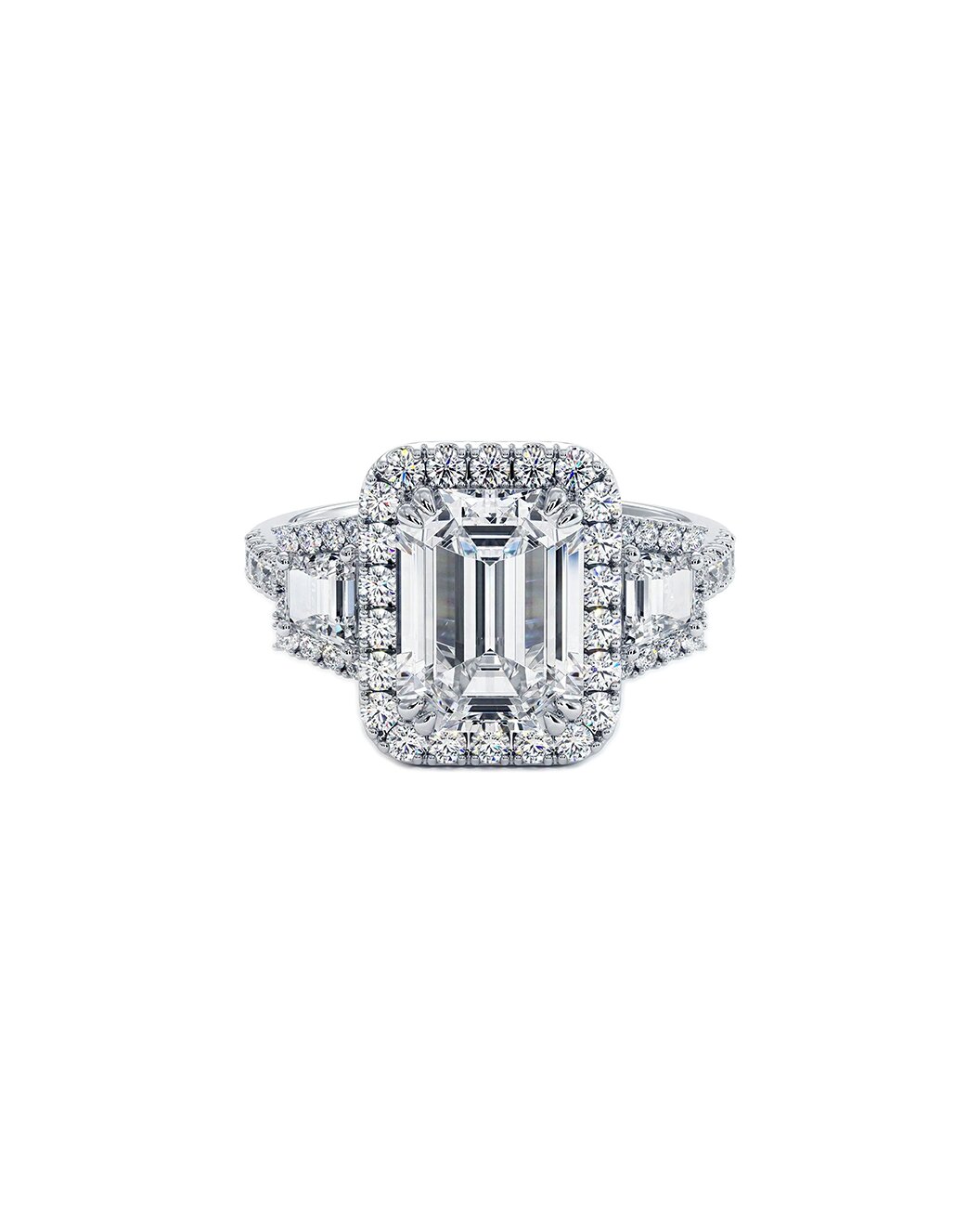 Diamond ring with emerald-cut center stone on a white background