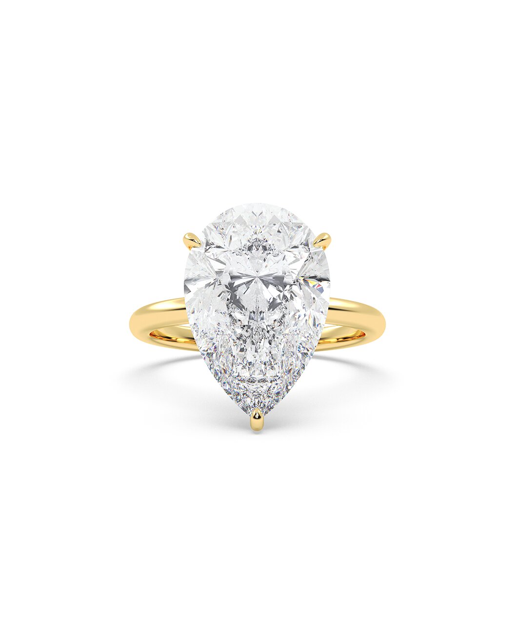 Yellow gold ring with a pear-shaped diamond on a white background