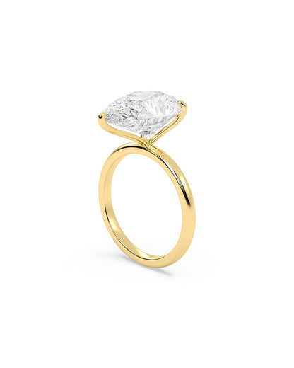 Yellow gold ring with a large diamond on a white background