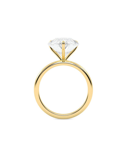 Yellow old ring with a clear diamond on a white background