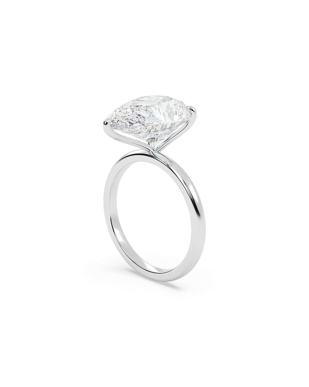 Diamond ring with a pear-cut diamond on a white background