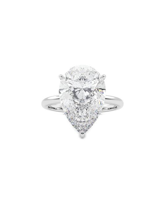 Pear-shaped diamond ring on a white background