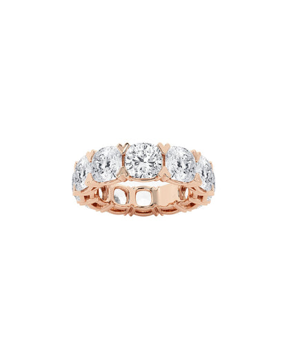 Rose gold ring with multiple cushion diamonds on a white background