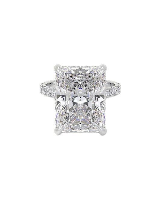 Diamond ring with an Emerald shaped diamond on a white background