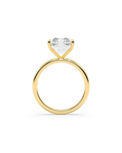 Yellow gold ring with a radiant-shaped diamond on a white background