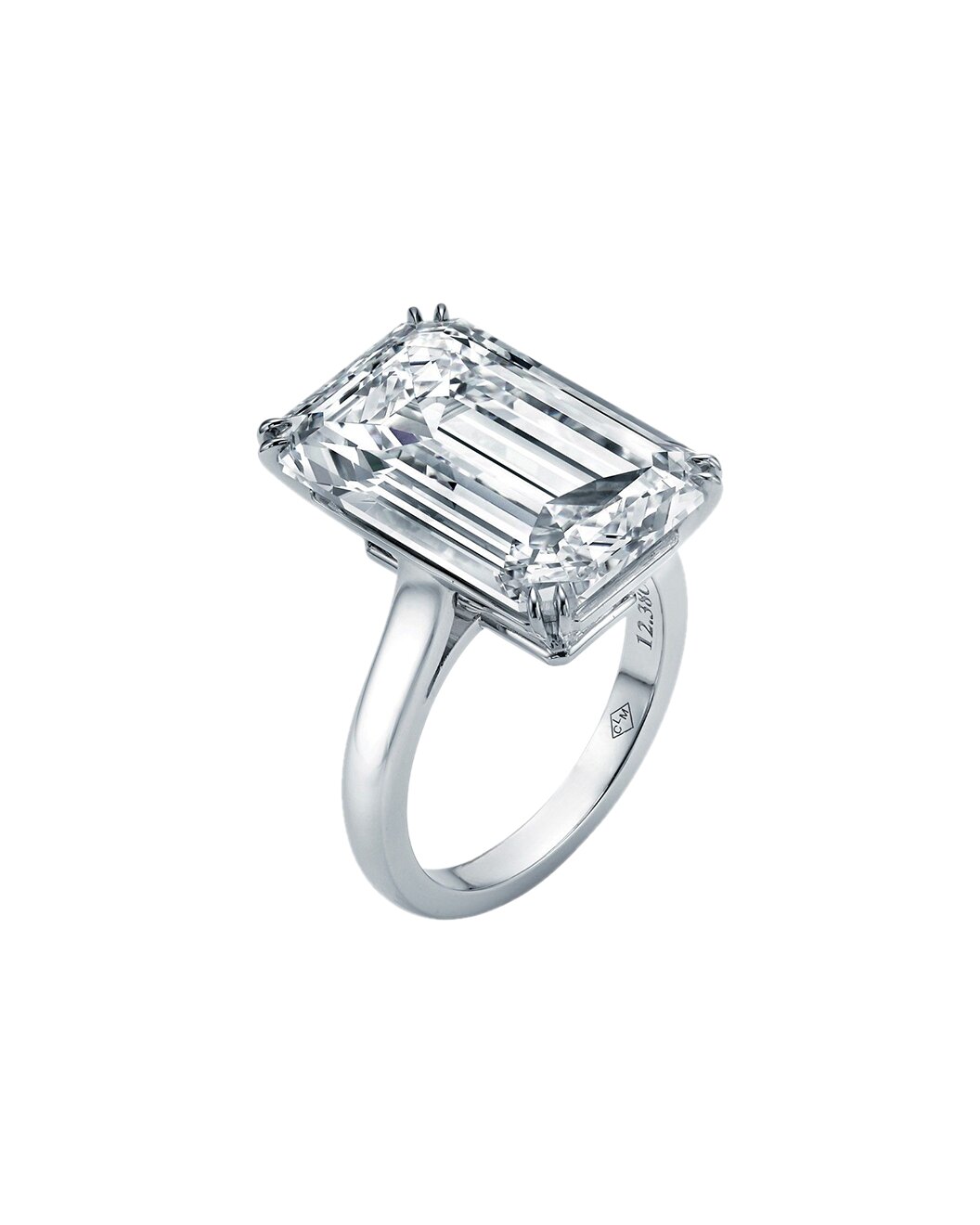 Diamond ring with emerald-cut diamond on a white background