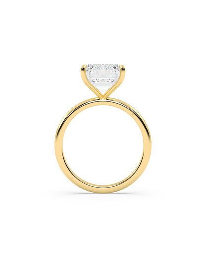 Yellow Gold ring with a heart-shaped diamond on a white background