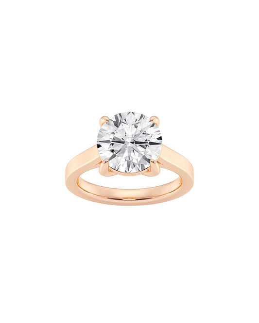 Rose gold ring with a large diamond on a white background