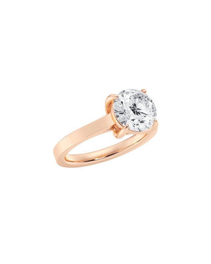 Rose gold ring with a large diamond on a white background Angle