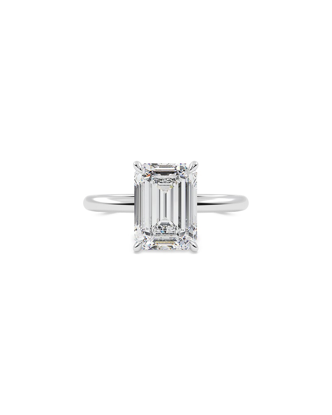 Diamond ring with emerald-cut gemstone on a white background
