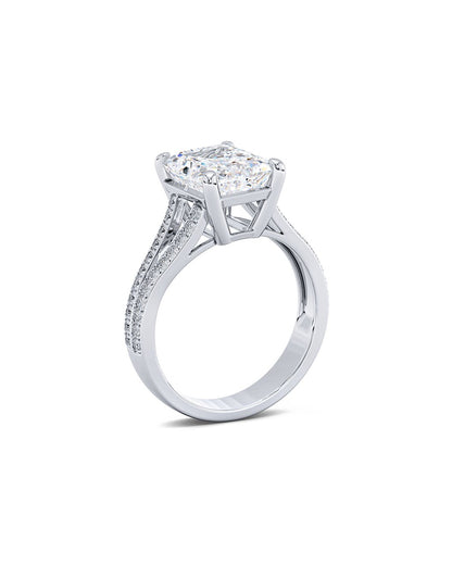 Diamond ring with a central gemstone and smaller stones on a white background