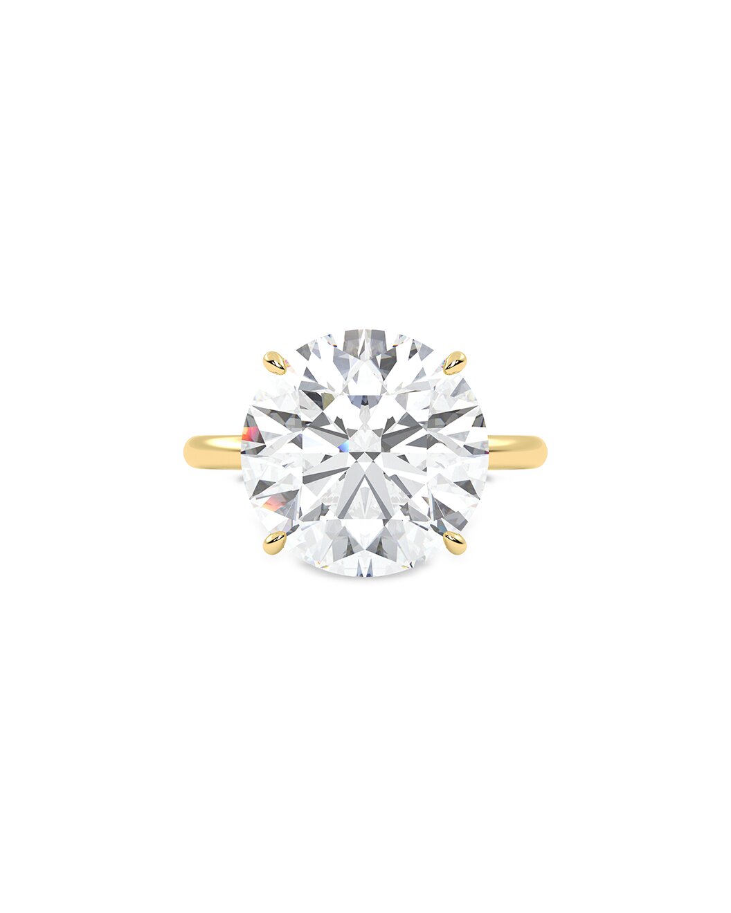 Yellow gold ring with a large diamond on a white background