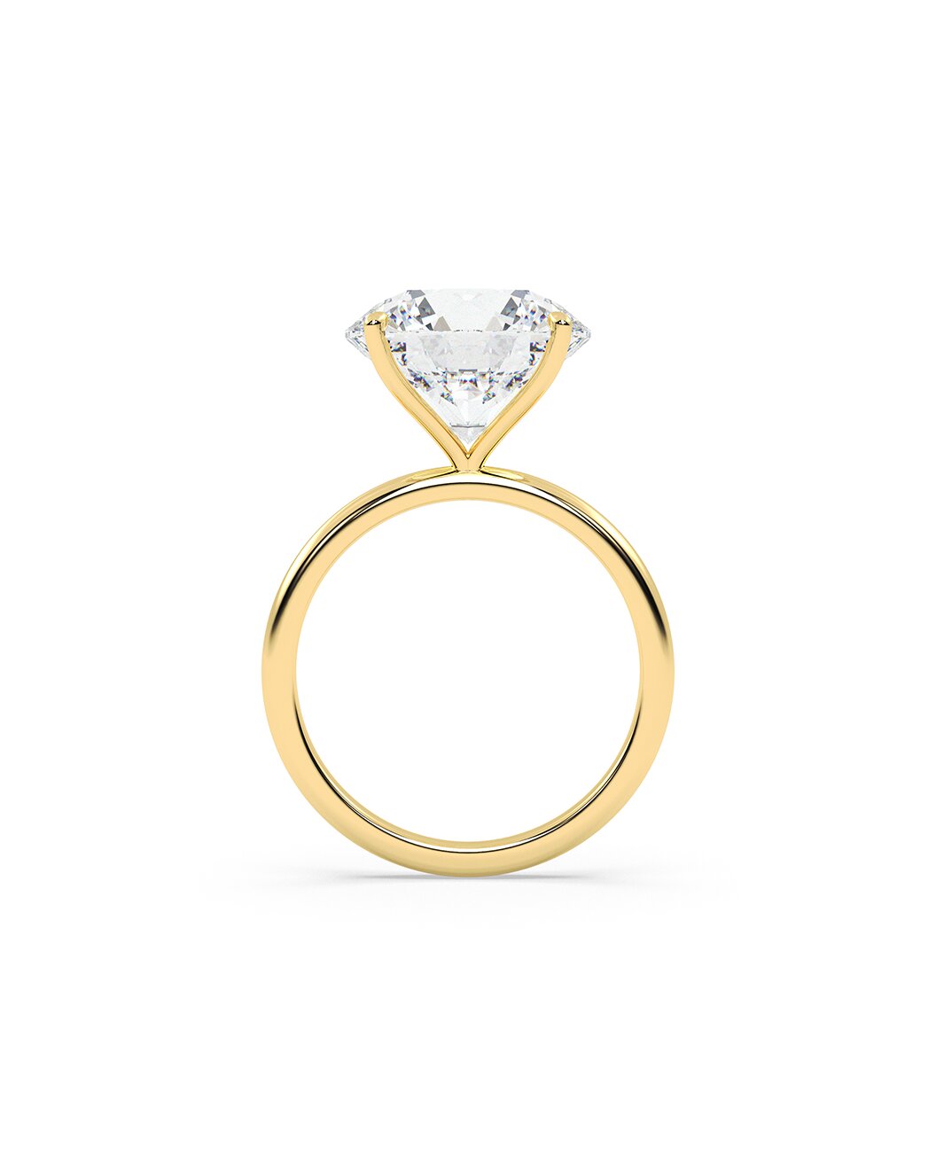 Yellow gold ring with a clear diamond on a white background