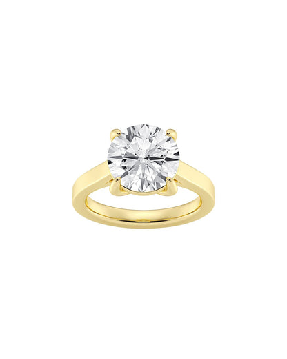 Yellow gold ring with a large diamond on a white background