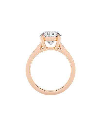 Rose gold ring with a diamond on a white background Side