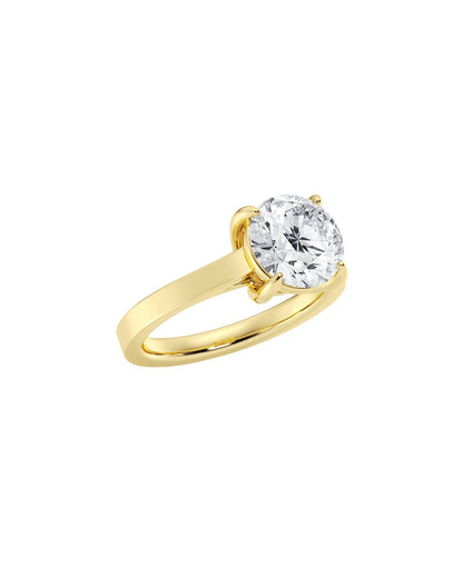 Gold ring with a diamond on a white background angle