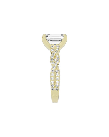 Gold ring with sidestone diamonds on a white background