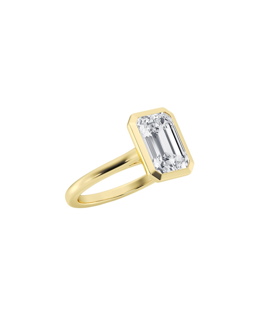 Bezel gold ring with an emerald diamond on a white background