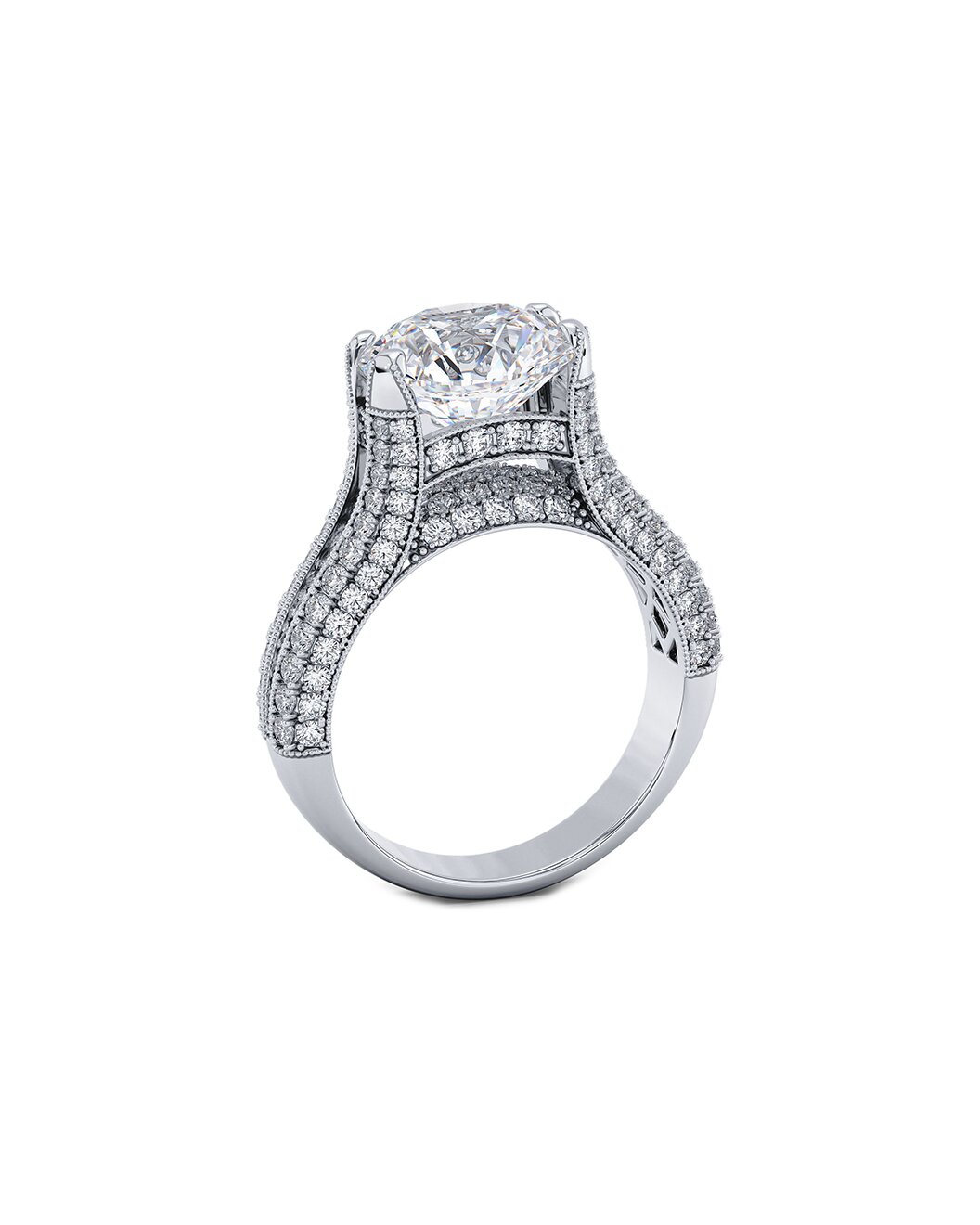 Diamond ring with a central round cut gemstone and smaller stones on a white background
