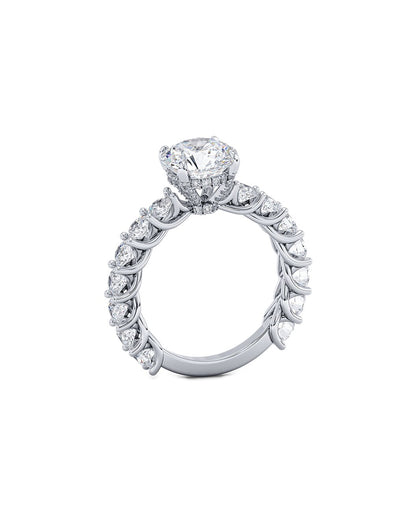 Diamond ring with a central gemstone and smaller diamonds on a white background