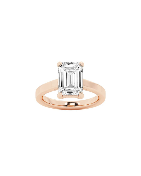Rose gold ring with a large diamond on a white background