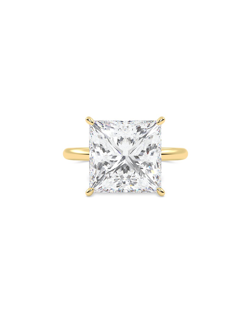 yellow gold ring with a large princess cut diamond on a white background