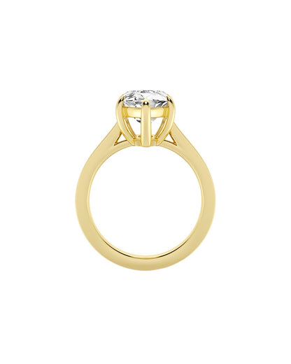 Yellow gold ring with a diamond on a white background
