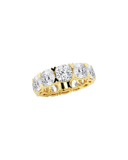 Gold eternity ring with cushion diamonds on a white background