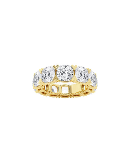 Gold eternity ring with cushion diamonds on a white background