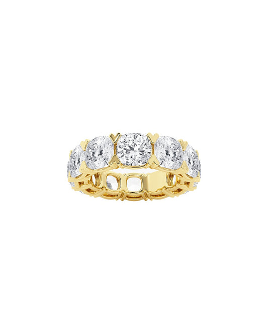 Gold eternity ring with cushion diamonds on a white background