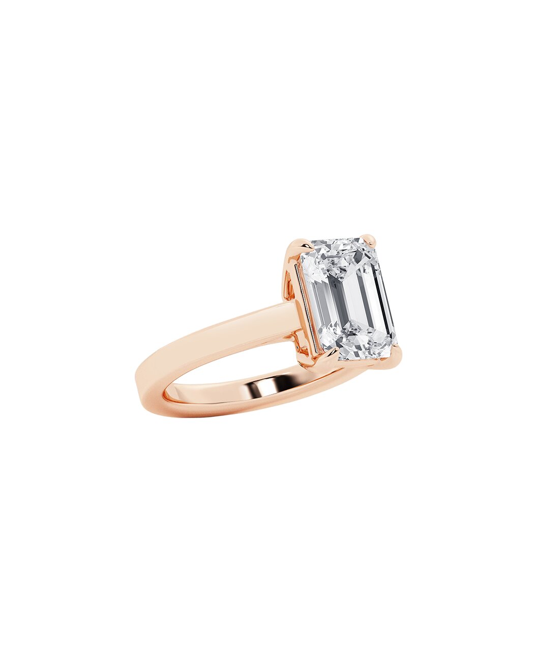 Rose gold ring with an emerald diamond on a white background